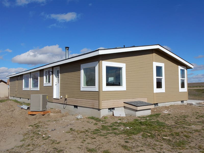 manufactured home sitting on a concrete foundation