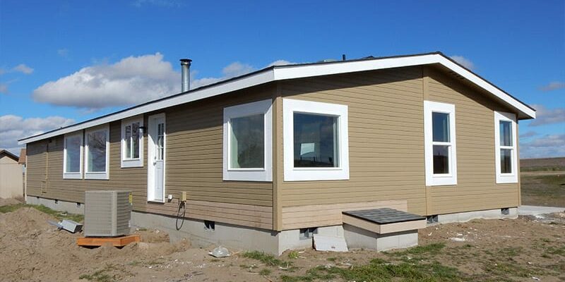 manufactured home sitting on a concrete foundation